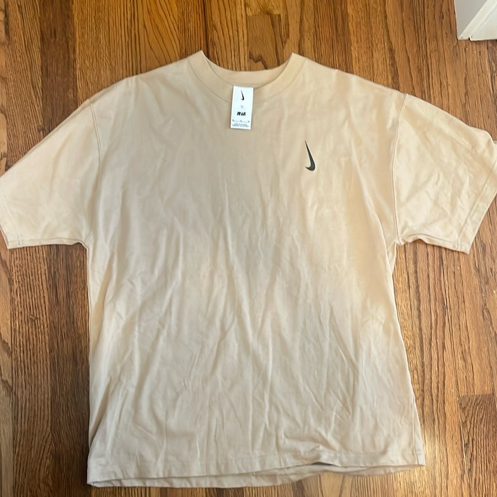 Nike Men's Short Sleeve T-Shirt in Light Beige with Black Swoosh